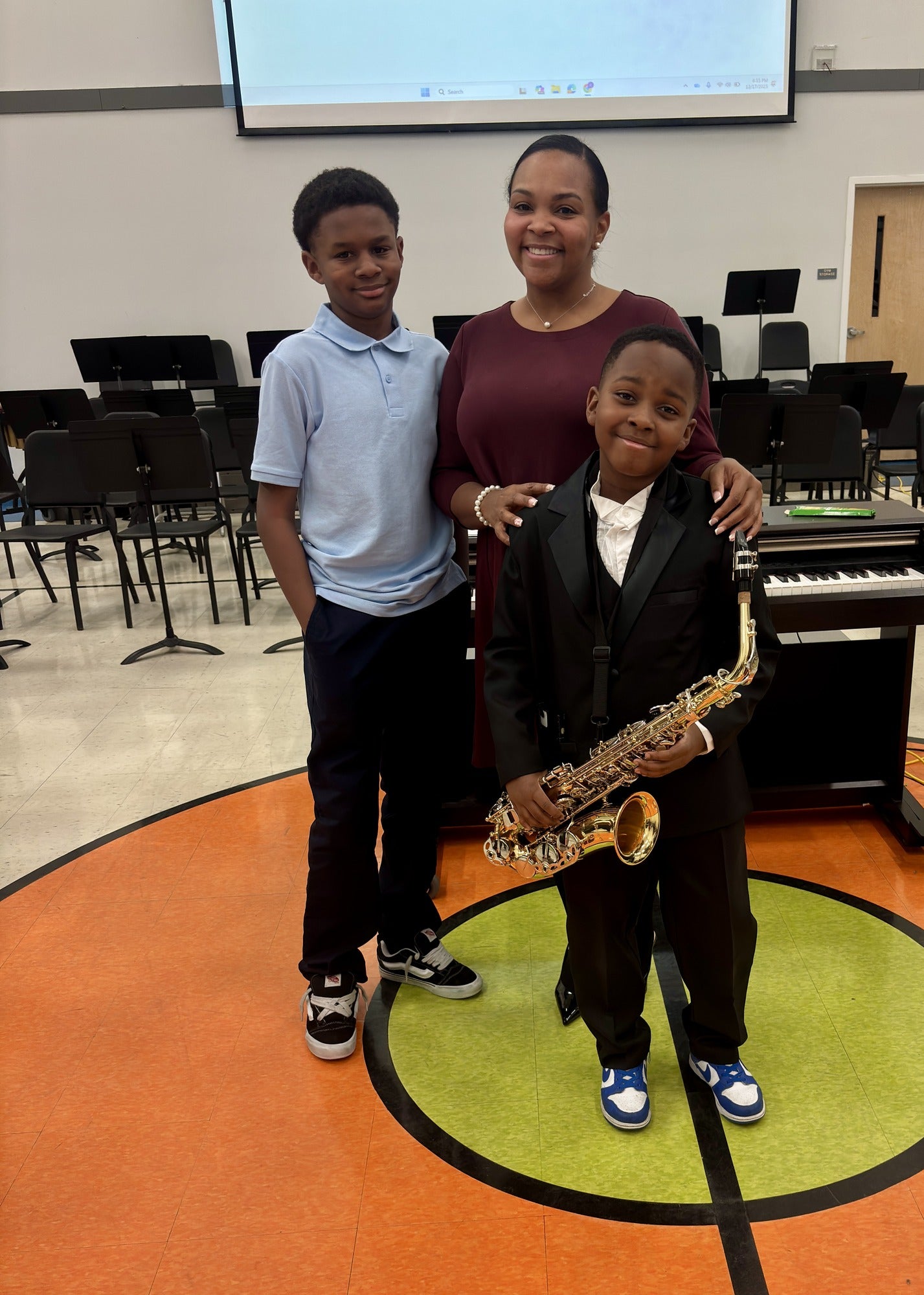 From left to right: Trayvion Bailey, Pennie Bailey and Mason Bailey at his musical recital. 